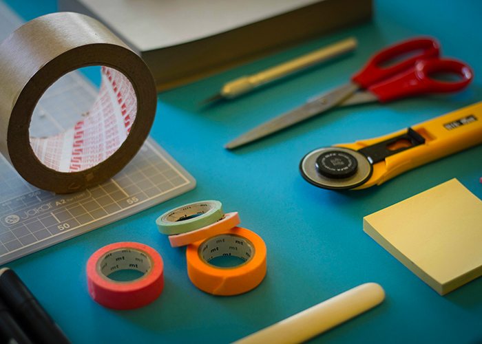 assorted-color office items on table